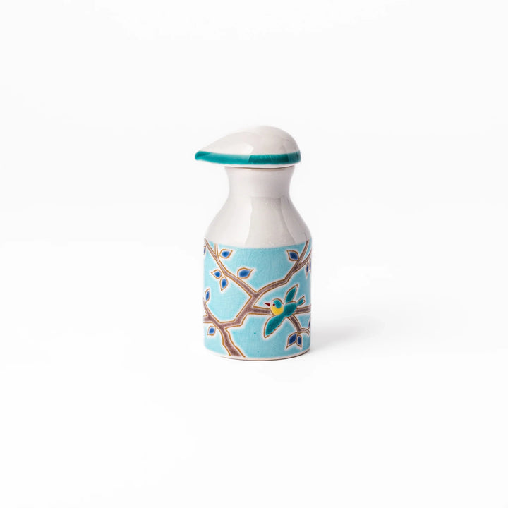 Japanese ceramic soy sauce dispenser with a turquoise lid and bird and branch motif, beautifully handcrafted in Arita Japan.