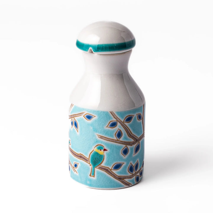 Japanese ceramic soy sauce dispenser with a turquoise lid and bird and branch motif, beautifully handcrafted in Arita Japan.