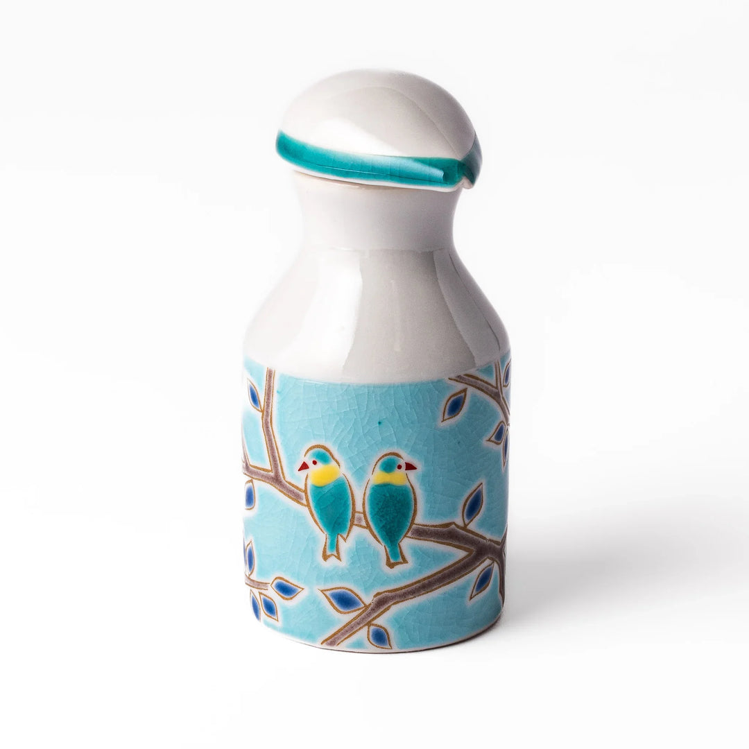 Japanese ceramic soy sauce dispenser with a turquoise lid and bird and branch motif, beautifully handcrafted in Arita Japan.