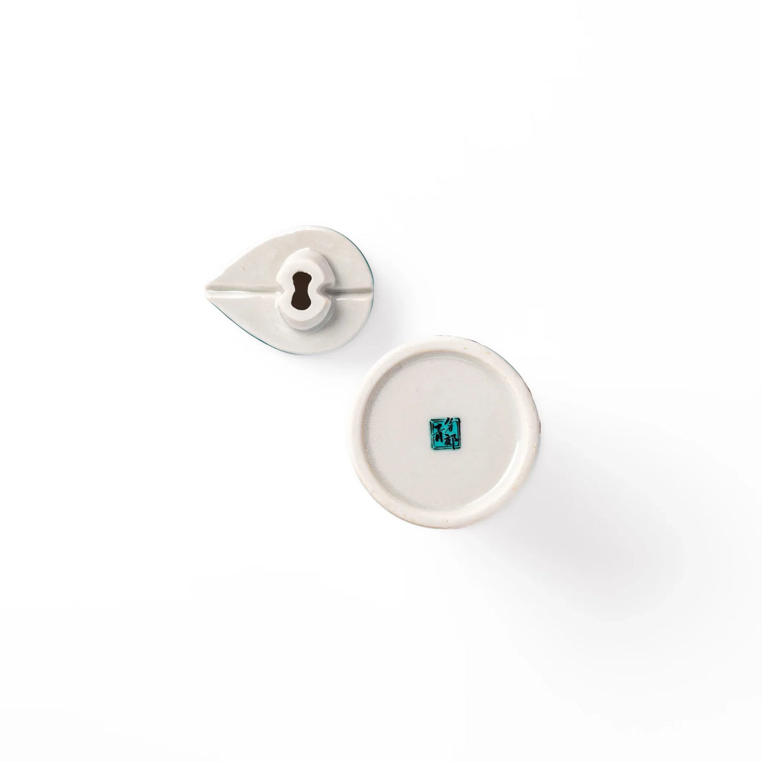 Japanese ceramic soy sauce dispenser with a turquoise lid and bird and branch motif, beautifully handcrafted in Arita Japan.