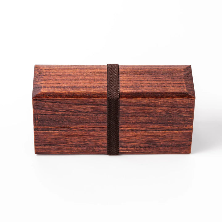 Dark brown Japanese two tier bento box made of paulownia wood with black band for elegant lunch style.