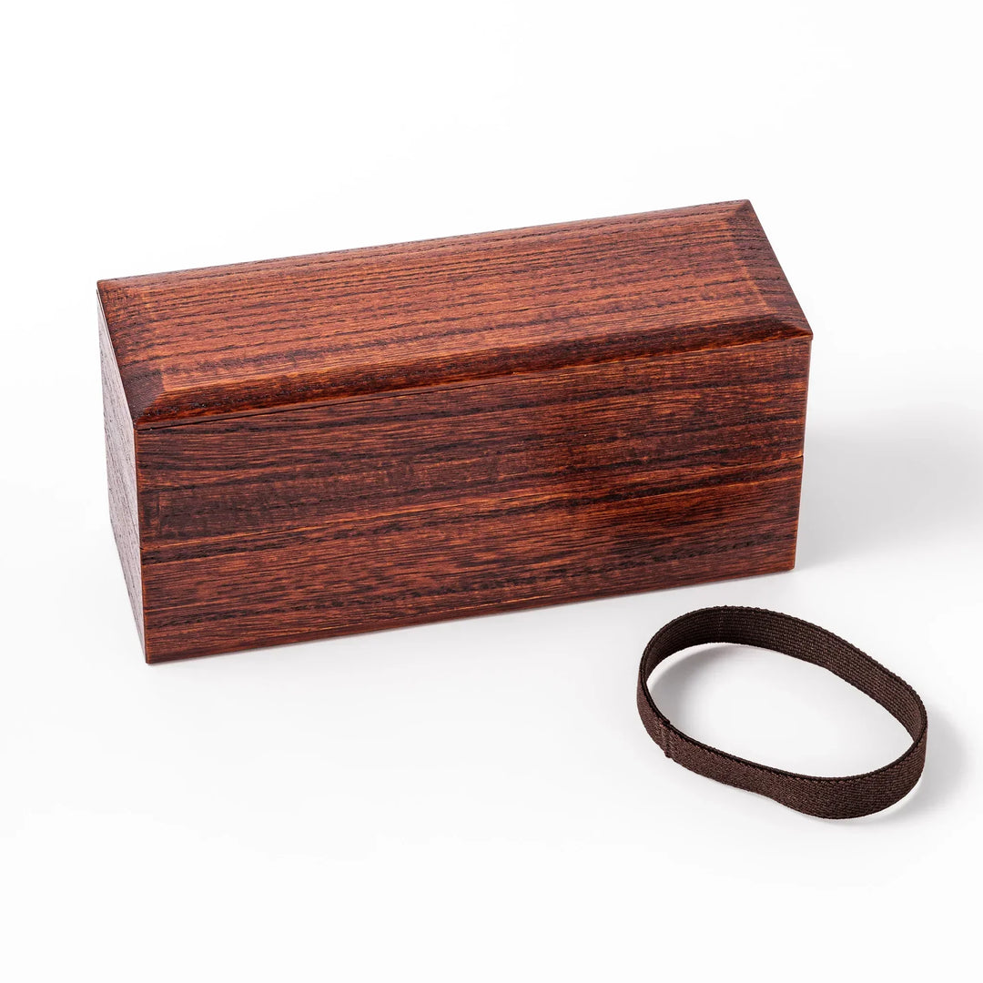 Dark brown Japanese two tier bento box made of paulownia wood with black band for elegant lunch style.
