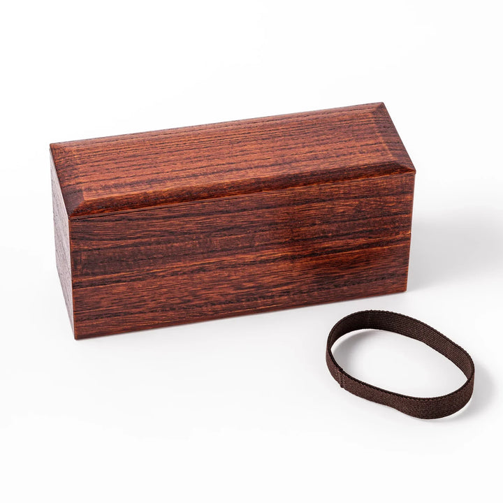Dark brown Japanese two tier bento box made of paulownia wood with black band for elegant lunch style.