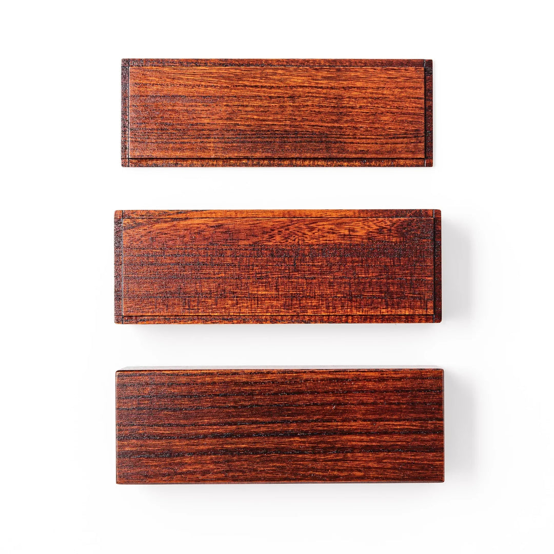 Rectangular Japanese two tier bento box made of dark brown paulownia wood with sleek minimalist design.