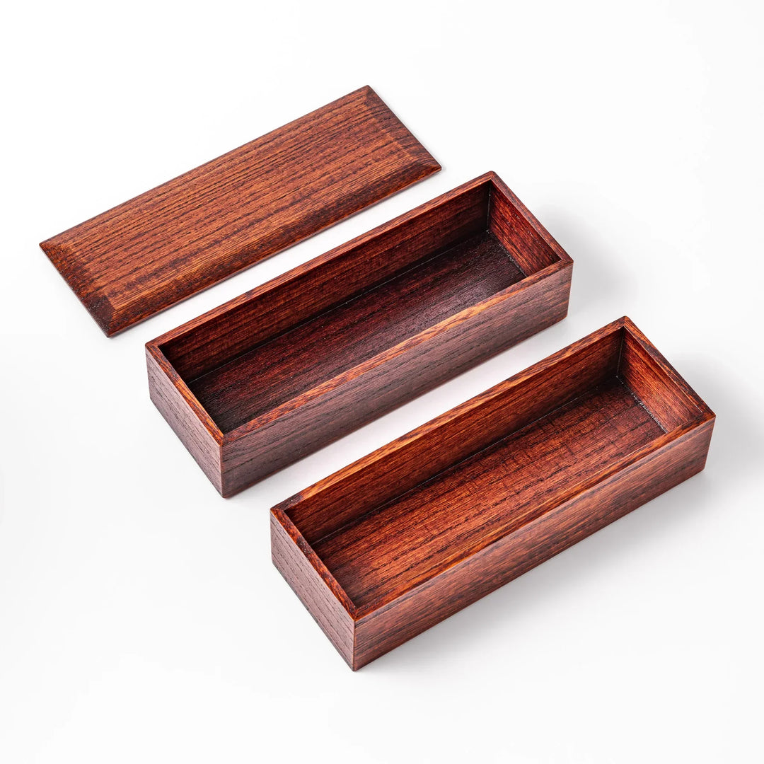 Rectangular Japanese two tier bento box made of dark brown paulownia wood with sleek minimalist design.
