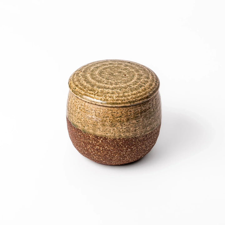 Two tone Japanese ceramic rice storage bowl with lid glazed top and textured brown base for rustic charm.