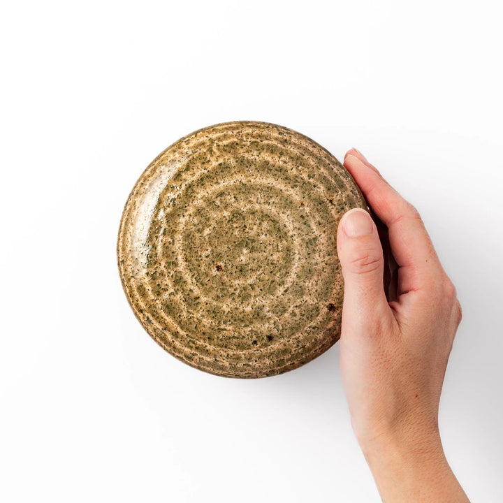 Two tone Japanese ceramic rice storage bowl with lid glazed top and textured brown base for rustic charm.