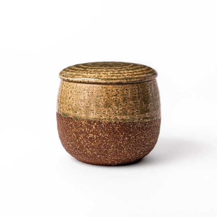 Two tone Japanese ceramic rice storage bowl with lid glazed top and textured brown base for rustic charm.
