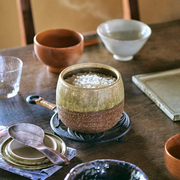Two tone Japanese ceramic rice storage bowl with lid glazed top and textured brown base for rustic charm.