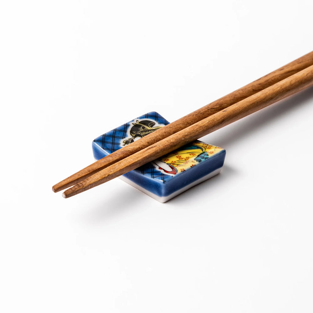 Rectangular Japanese ceramic chopstick rest with courtesan design inspired by Utamaro ukiyoe artistry.