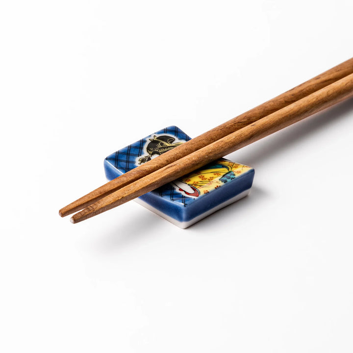 Rectangular Japanese ceramic chopstick rest with courtesan design inspired by Utamaro ukiyoe artistry.
