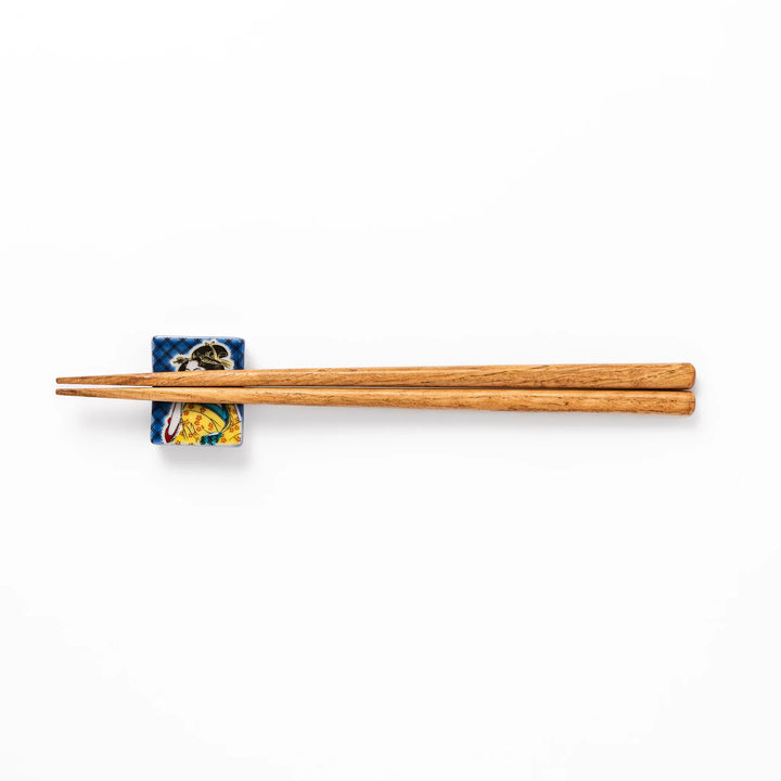 Rectangular Japanese ceramic chopstick rest with courtesan design inspired by Utamaro ukiyoe artistry.