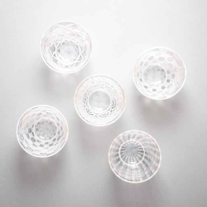 Assorted vintage Japanese glass tea cups with textured patterns in lattice wave stripe and polka dot design minimalist tableware set