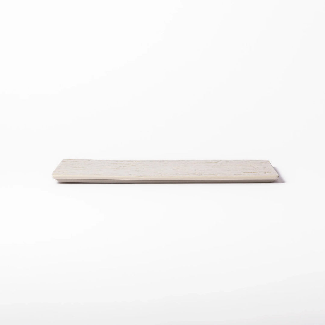 White Japanese ceramic dinner plate with subtle woodgrain texture for elegant minimalist table settings.