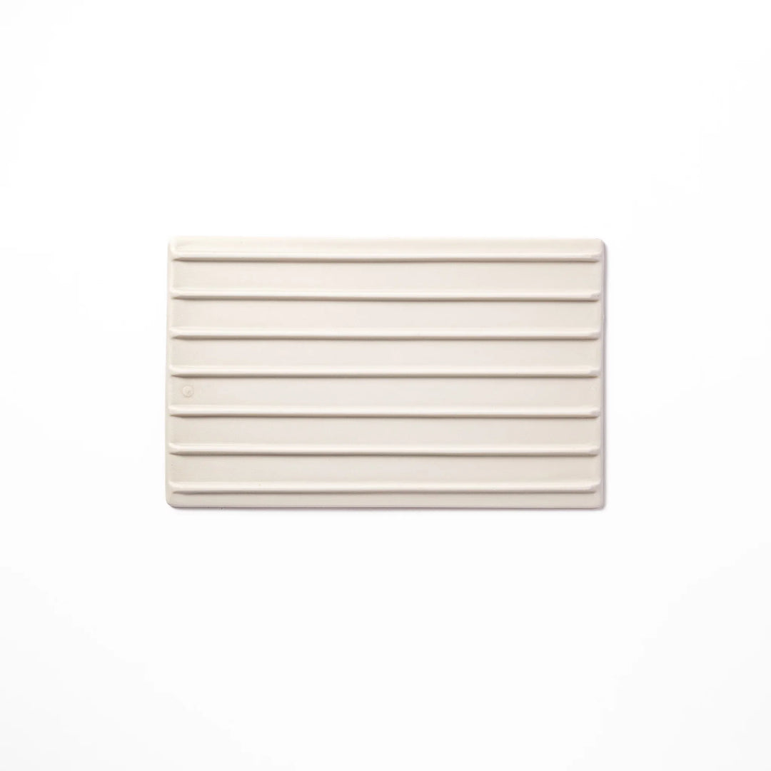 White Japanese ceramic dinner plate with subtle woodgrain texture for elegant minimalist table settings.