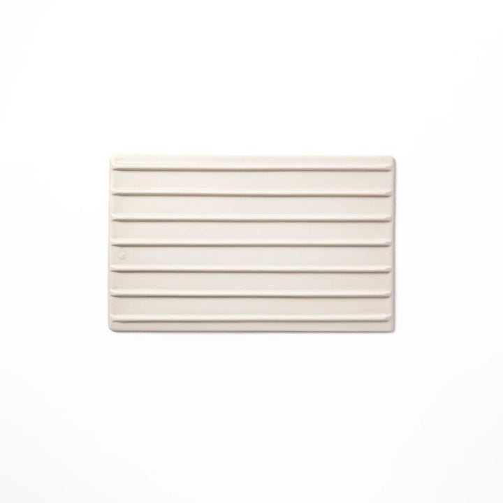 White Japanese ceramic dinner plate with subtle woodgrain texture for elegant minimalist table settings.