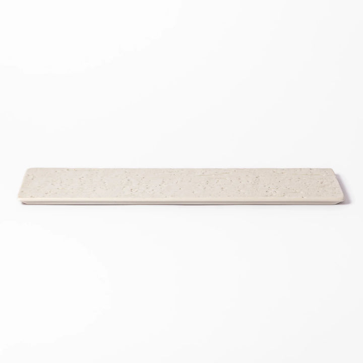 Rectangular white Japanese ceramic serving plate with woodgrain pattern for minimalist modern table setting.