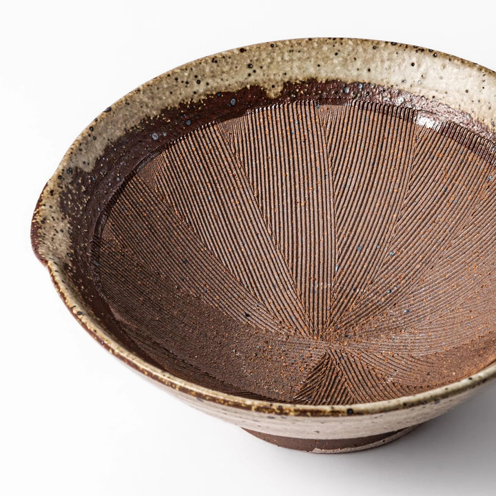 Speckled white Karatsu-style mortar with a deep brown interior and textured ridges, ideal for traditional sesame grinding.