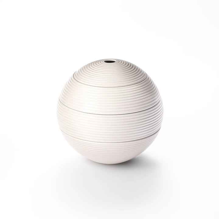 White porcelain moon shaped jubako box with textured ridged surface