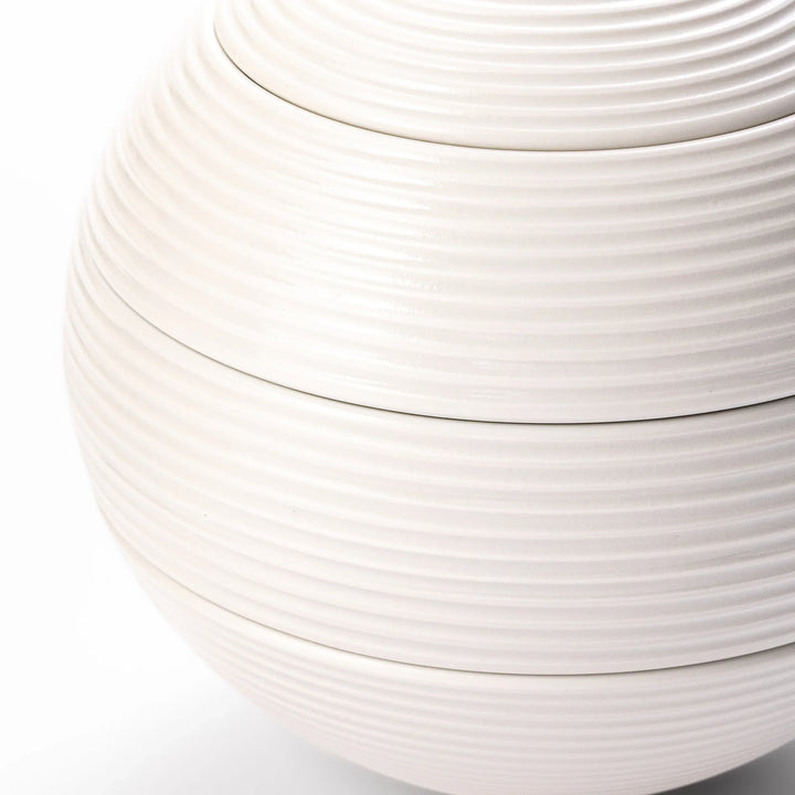 White porcelain moon shaped jubako box with textured ridged surface