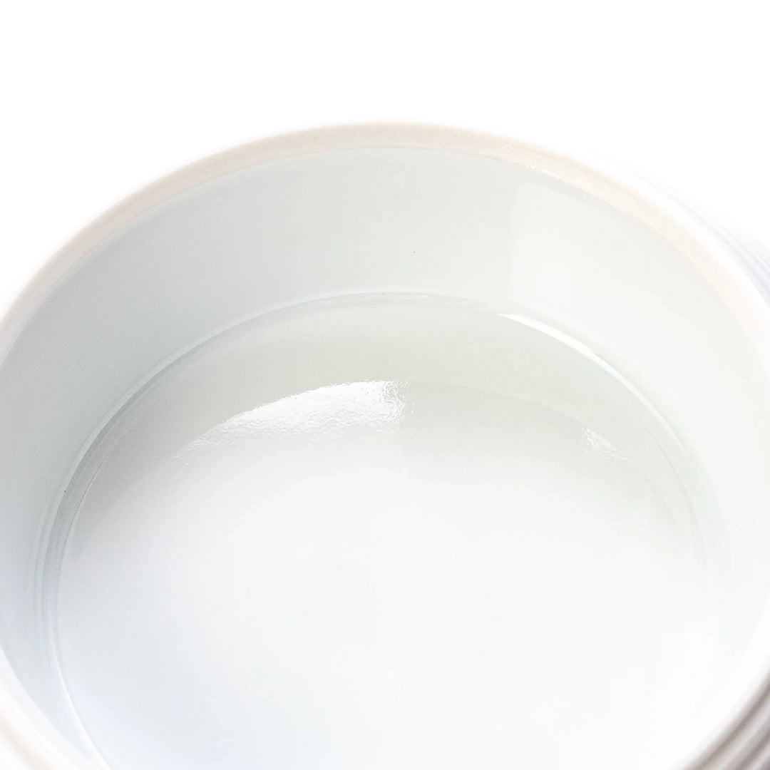 White porcelain moon shaped jubako box with textured ridged surface