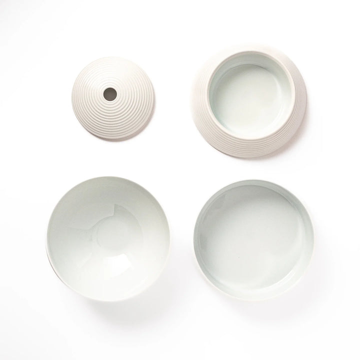 White porcelain moon shaped jubako box with textured ridged surface
