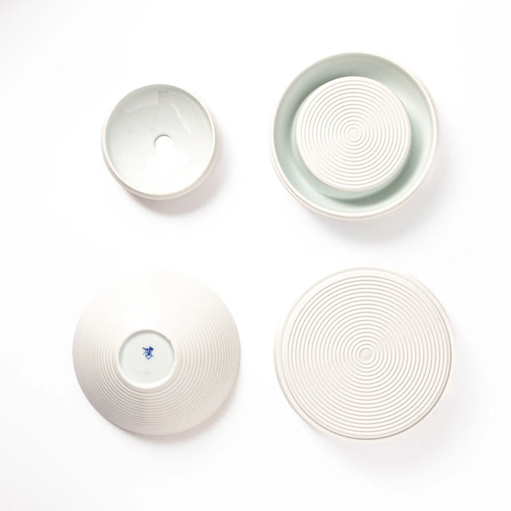 White porcelain moon shaped jubako box with textured ridged surface