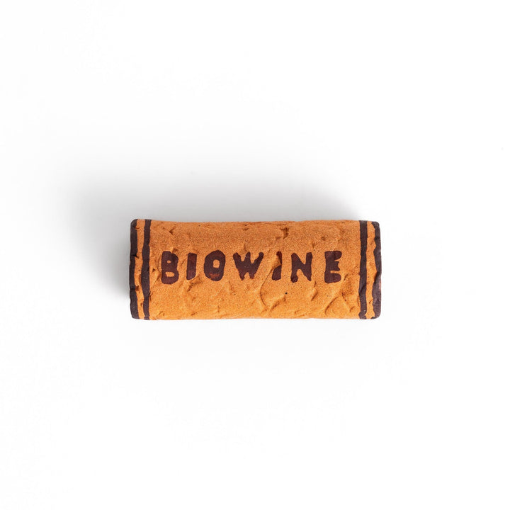 Fun chopstick rest shaped like a wine cork, featuring the word "BIOWINE" printed in bold on the side for a playful touch.