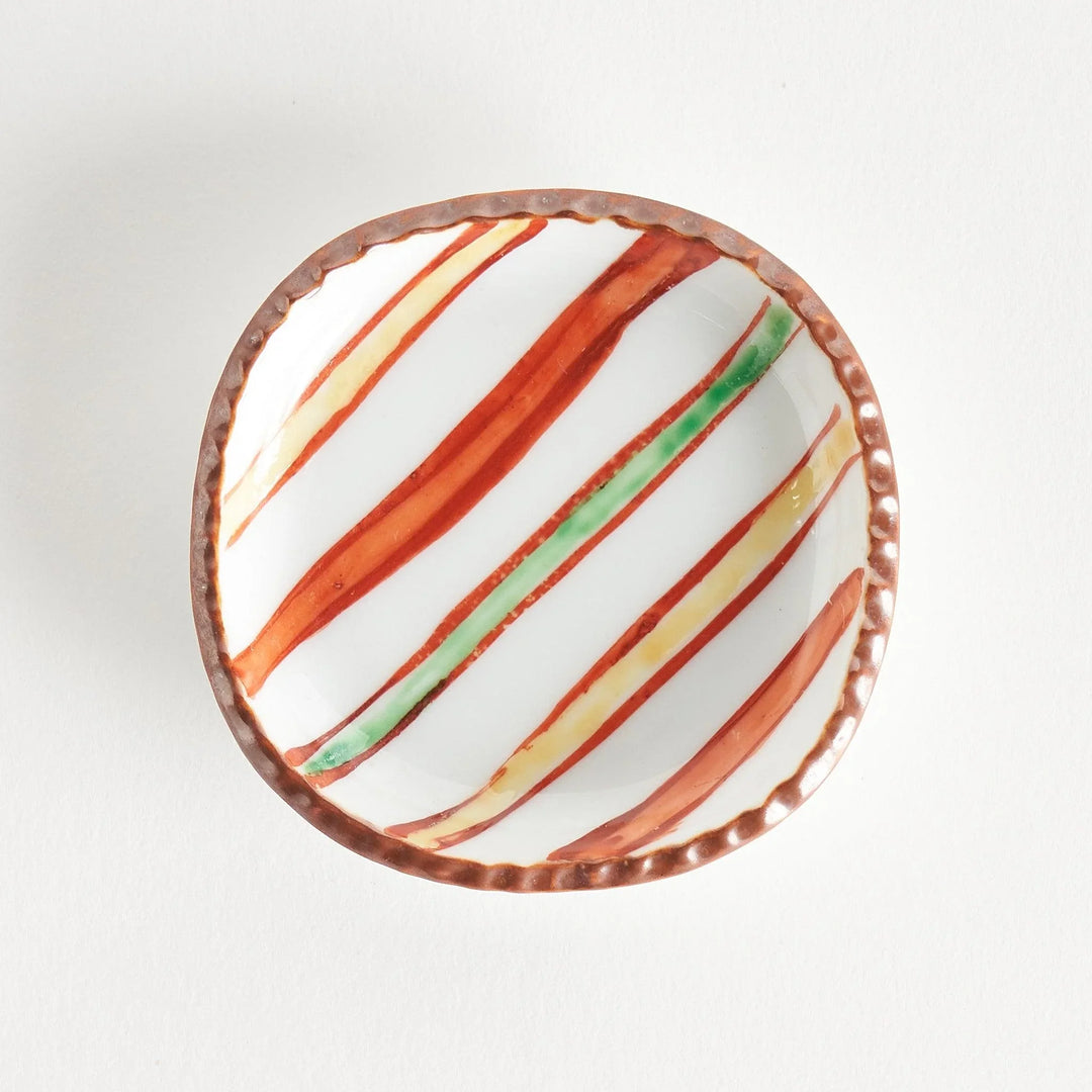 Red and green diagonal stripe Japanese sauce dish for serving soy sauce condiments or dipping sauces.
