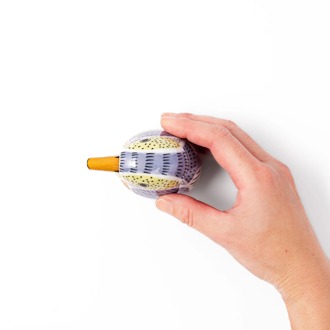 Bird-shaped soy sauce dispenser with purple and yellow hand-painted details, adding a playful touch to your table.