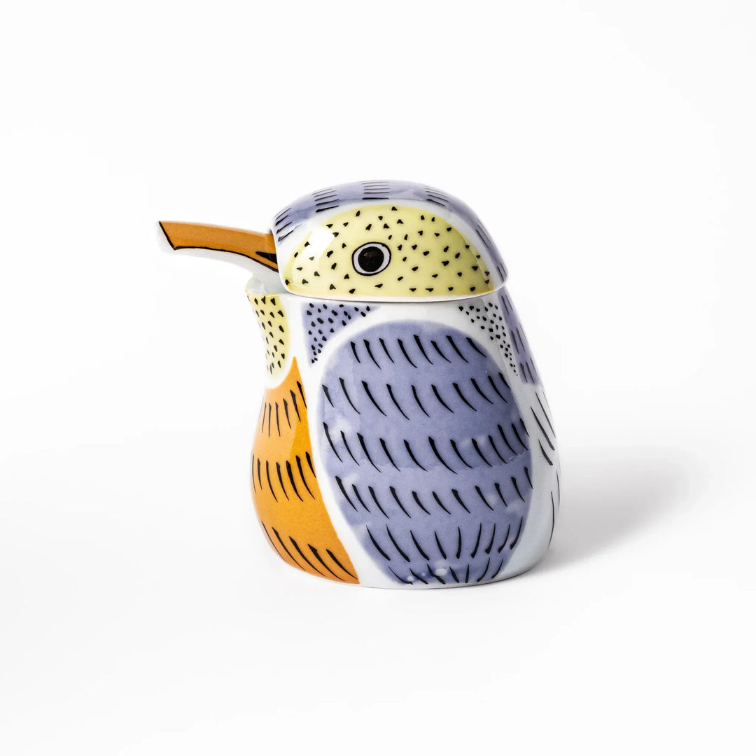 Bird-shaped soy sauce dispenser with purple and yellow hand-painted details, adding a playful touch to your table.