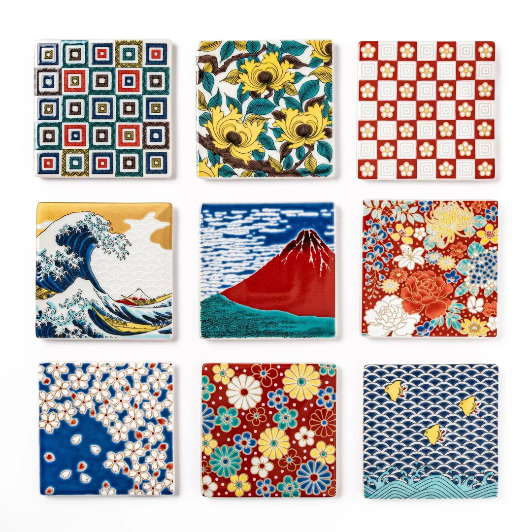 Set of Japanese ceramic coasters featuring traditional patterns like waves, Mt. Fuji, cherry blossoms, and floral motifs, perfect for elegant table settings.