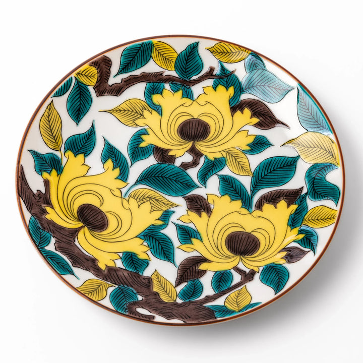 Japanese porcelain dessert plate with bold yellow peony blooms, green leaves, and brown branches on a white background