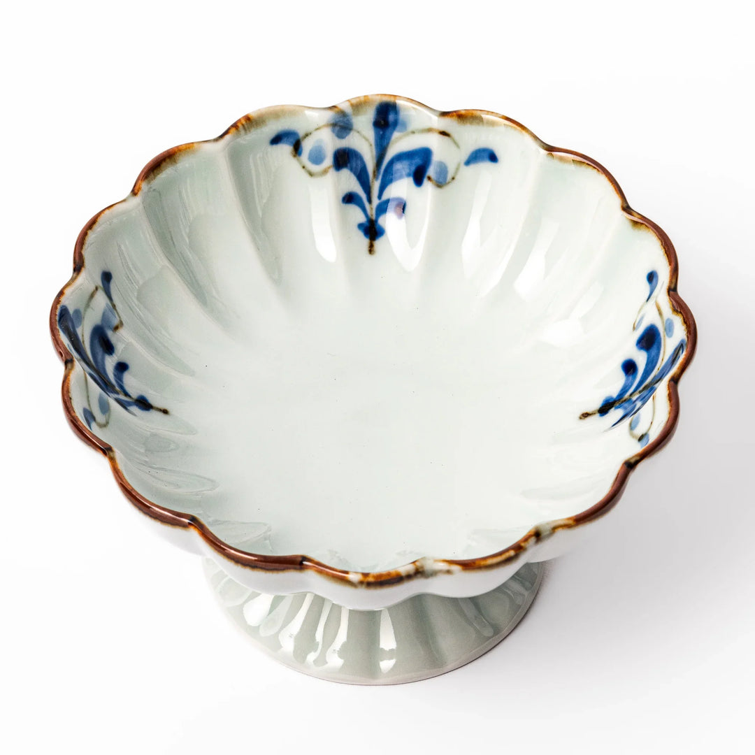 Arita porcelain pedestal bowl with blue arabesque pattern and gold rim, perfect for serving desserts, fruits, or side dishes.