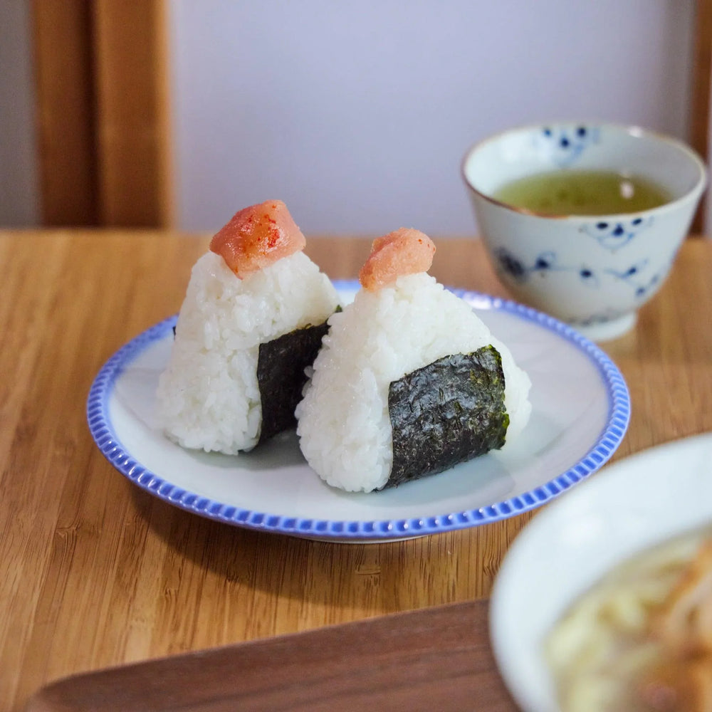 Rustic white plate with scalloped edges and a delicate blue rim, adding charm to everyday meals and desserts.