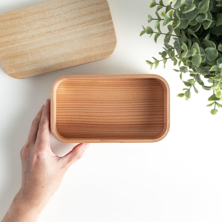 Opened Artisan Cedar Bento Box, revealing a spacious interior with a natural wood finish and seamless design.