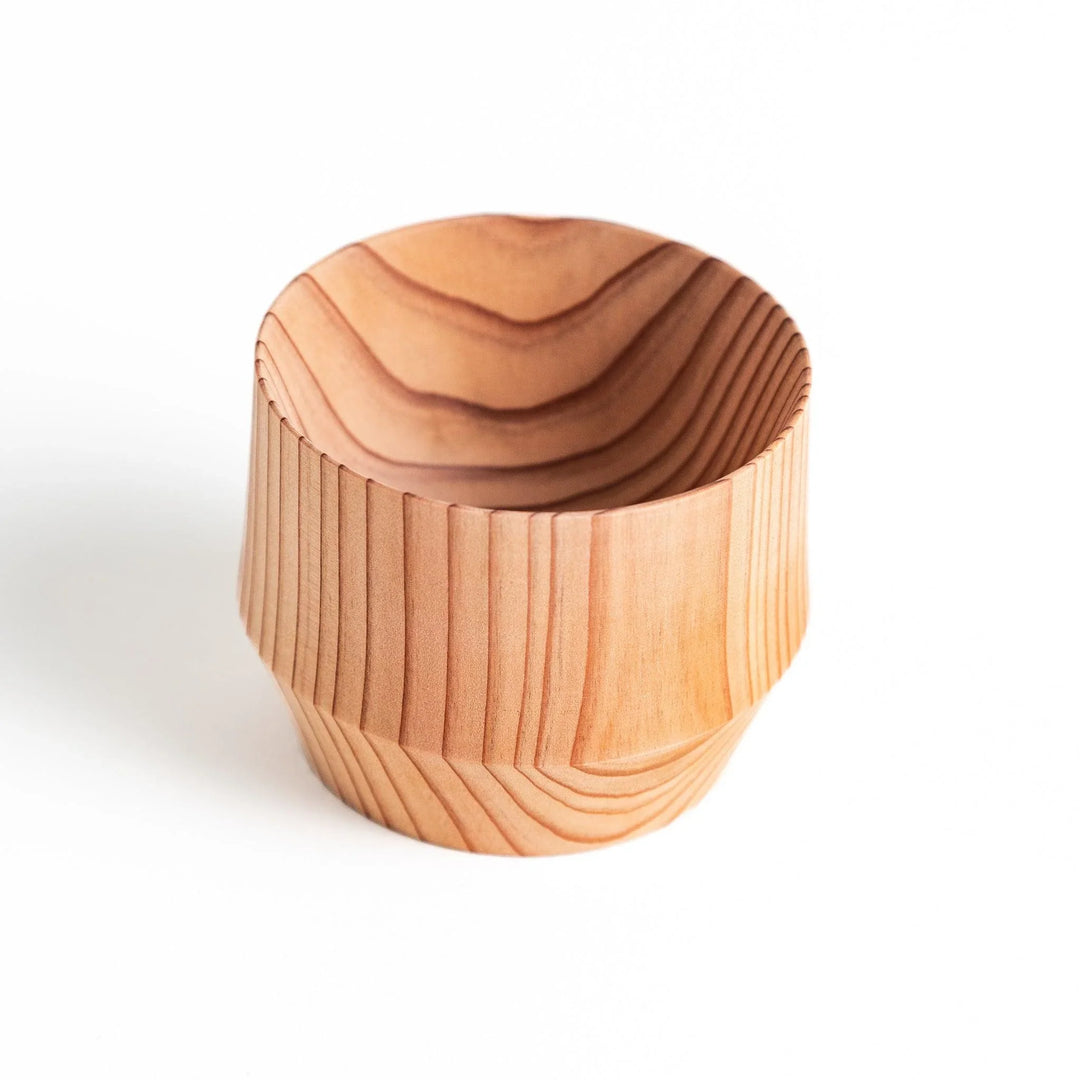 Beautifully crafted cedar sake cup, with finely detailed wood grain patterns, offering an elegant shape and texture.