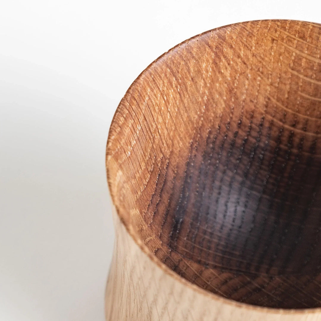 Elegant whisky cup with a gently tapered design and smooth texture, crafted from Mizunara oak for a refined feel.