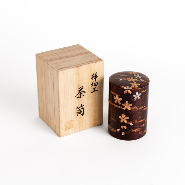 Cherry bark tea caddy with mother of pearl blossom inlay in wooden box perfect for storing fine tea.