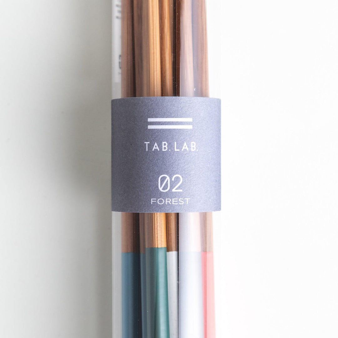 A set of wooden chopsticks with vibrant colored tops in various shades, including yellow, blue, orange, green, and white.