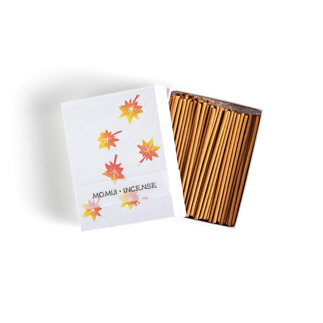 Incense with warm-toned sticks in a maple leaf design box offering an earthy autumn fragrance inspired by fall.