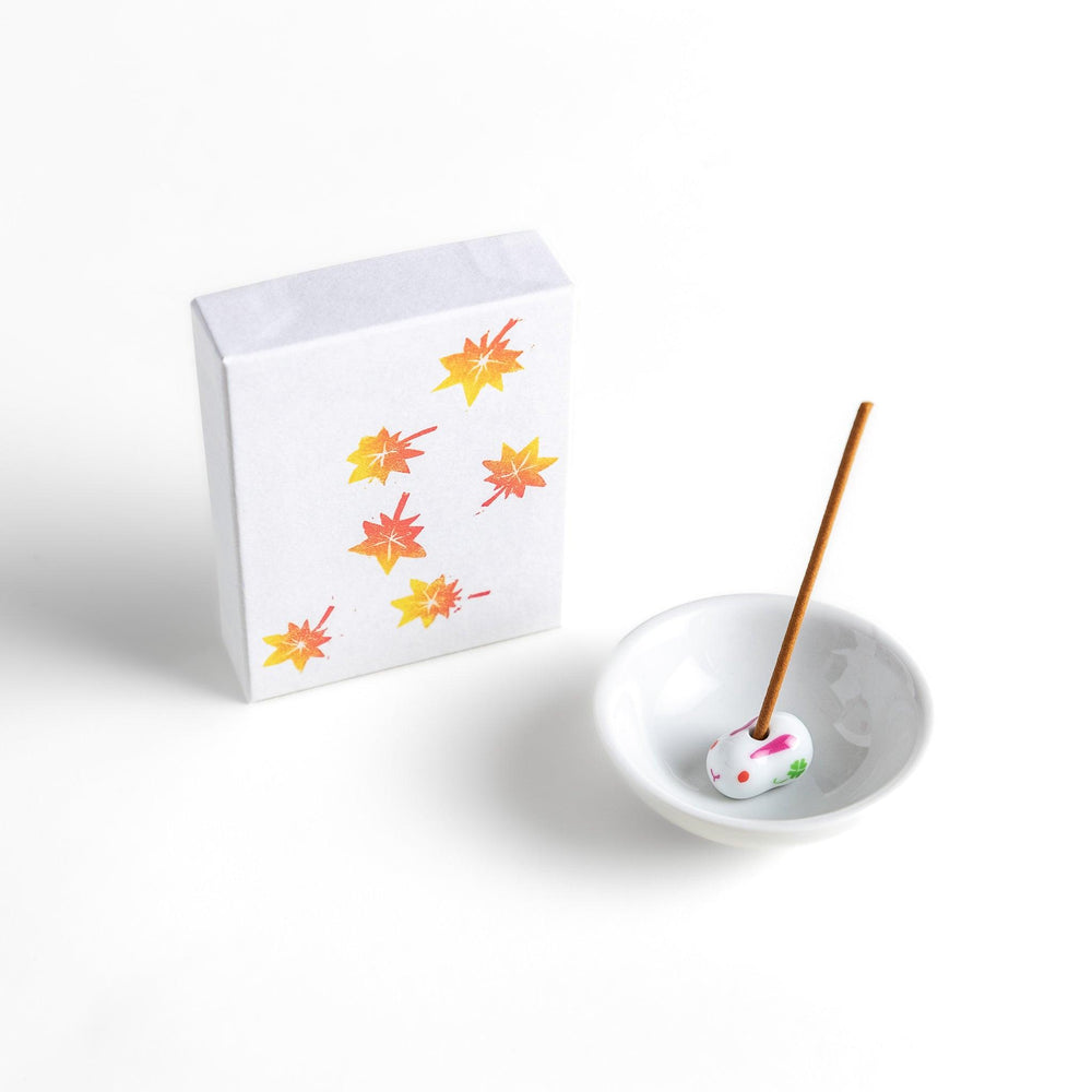 Incense with warm-toned sticks in a maple leaf design box offering an earthy autumn fragrance inspired by fall.