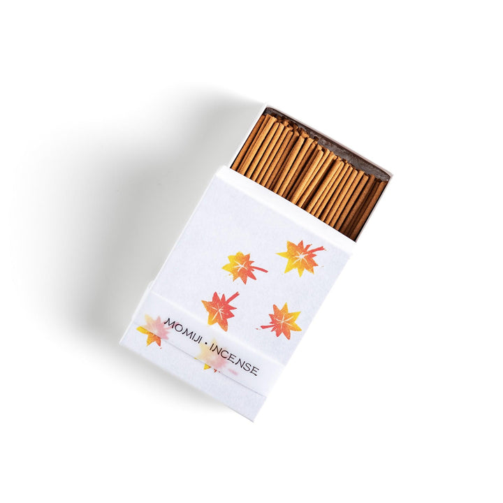 Incense with warm-toned sticks in a maple leaf design box offering an earthy autumn fragrance inspired by fall.
