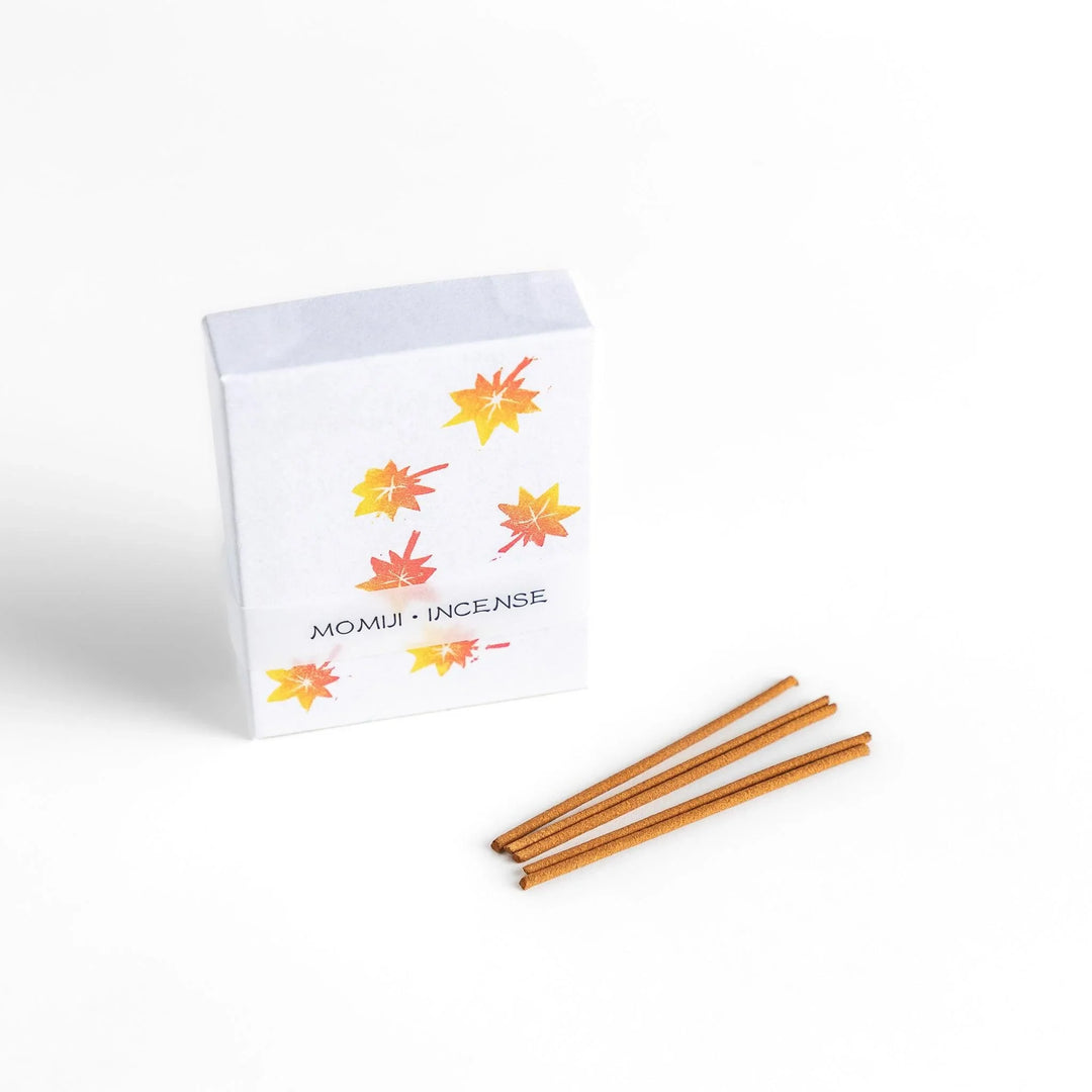 Incense with warm-toned sticks in a maple leaf design box offering an earthy autumn fragrance inspired by fall.