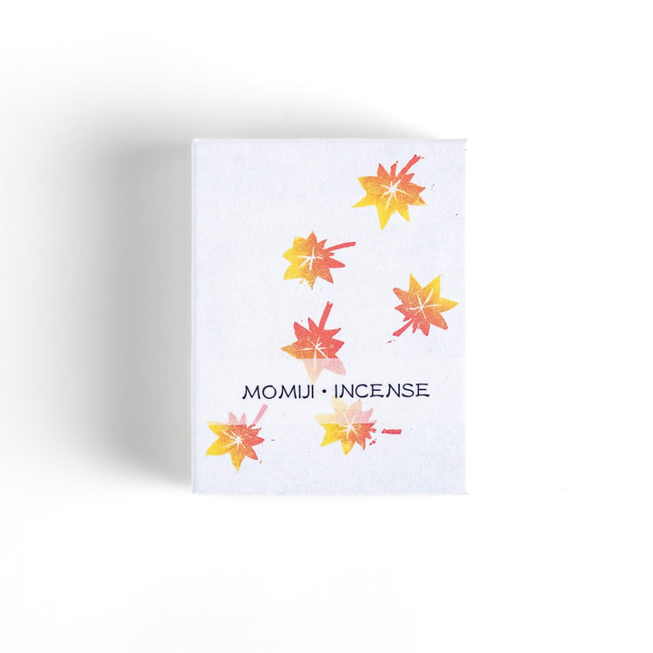 Incense with warm-toned sticks in a maple leaf design box offering an earthy autumn fragrance inspired by fall.