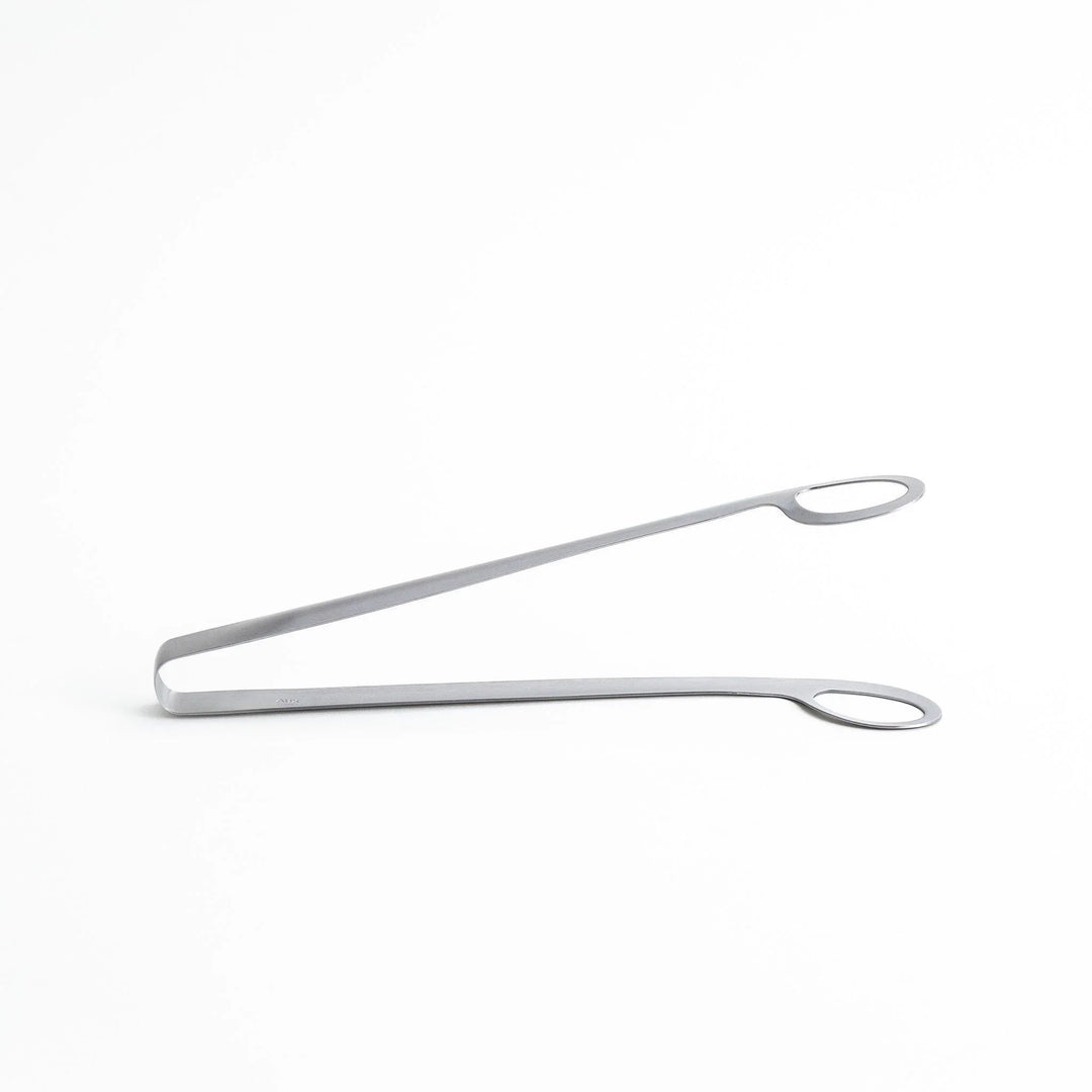 Curved stainless steel tongs with holes at the end for drainage