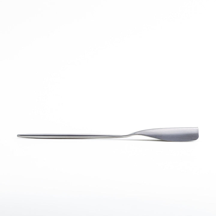 Long-handled stainless steel honey spoon with a uniquely shaped flat scoop