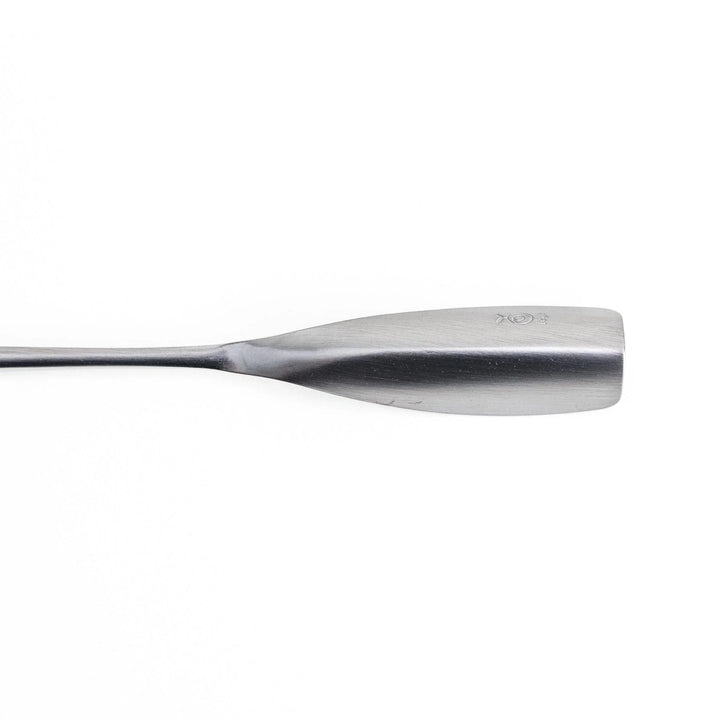 Long-handled stainless steel honey spoon with a uniquely shaped flat scoop