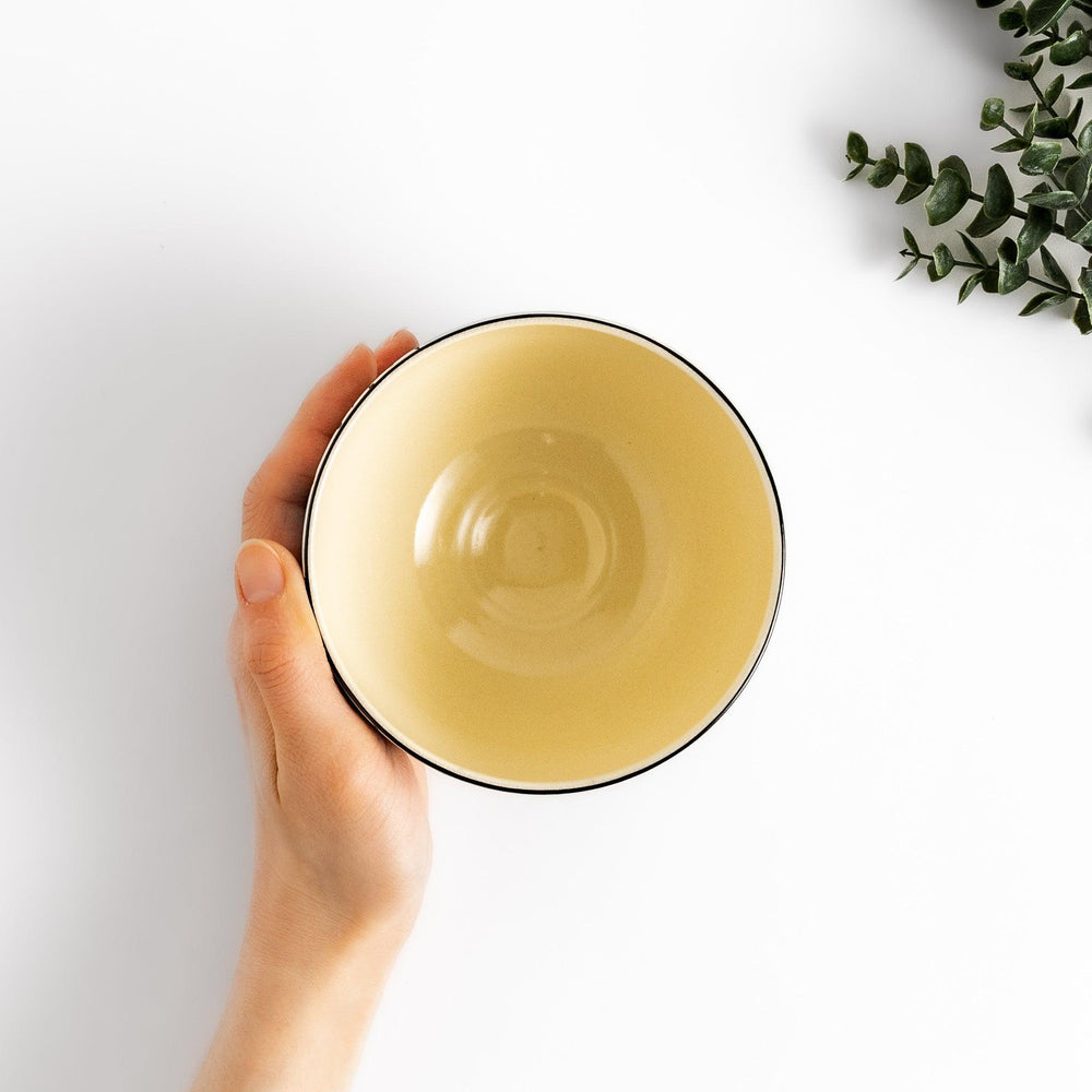 Plum Blossom Matcha Bowl with pink floral designs on a cream surface, adding elegance to your matcha moments.