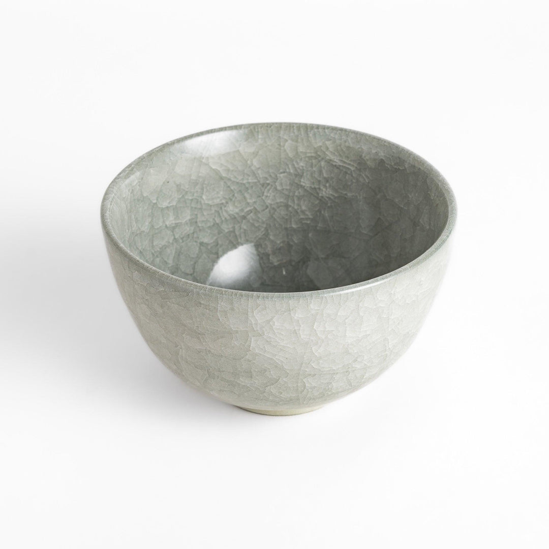 Azure clay matcha bowl with a smooth cracked texture, offering a calming, elegant design for an enjoyable tea experience.